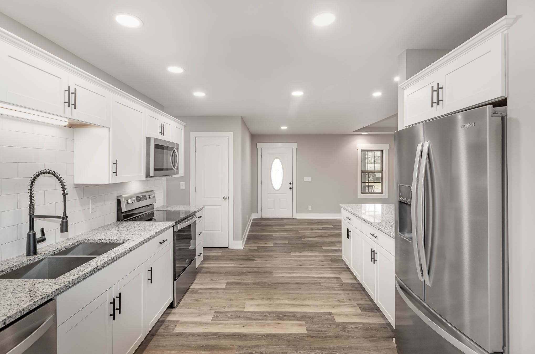 3910 Old Coopertown Road Springfield, TN 37172 - Photo 11 of 30 a large kitchen with stainless steel appliances granite countertop a refrigerator and a sink