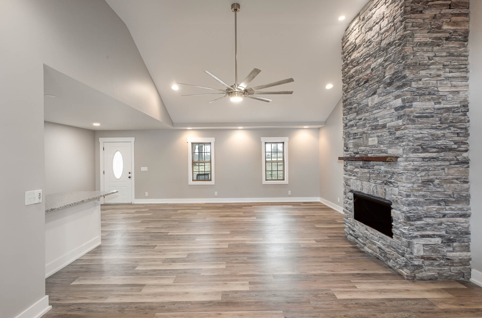 3910 Old Coopertown Road Springfield, TN 37172 - Photo 3 of 30 a view of an empty room with a fireplace and a window