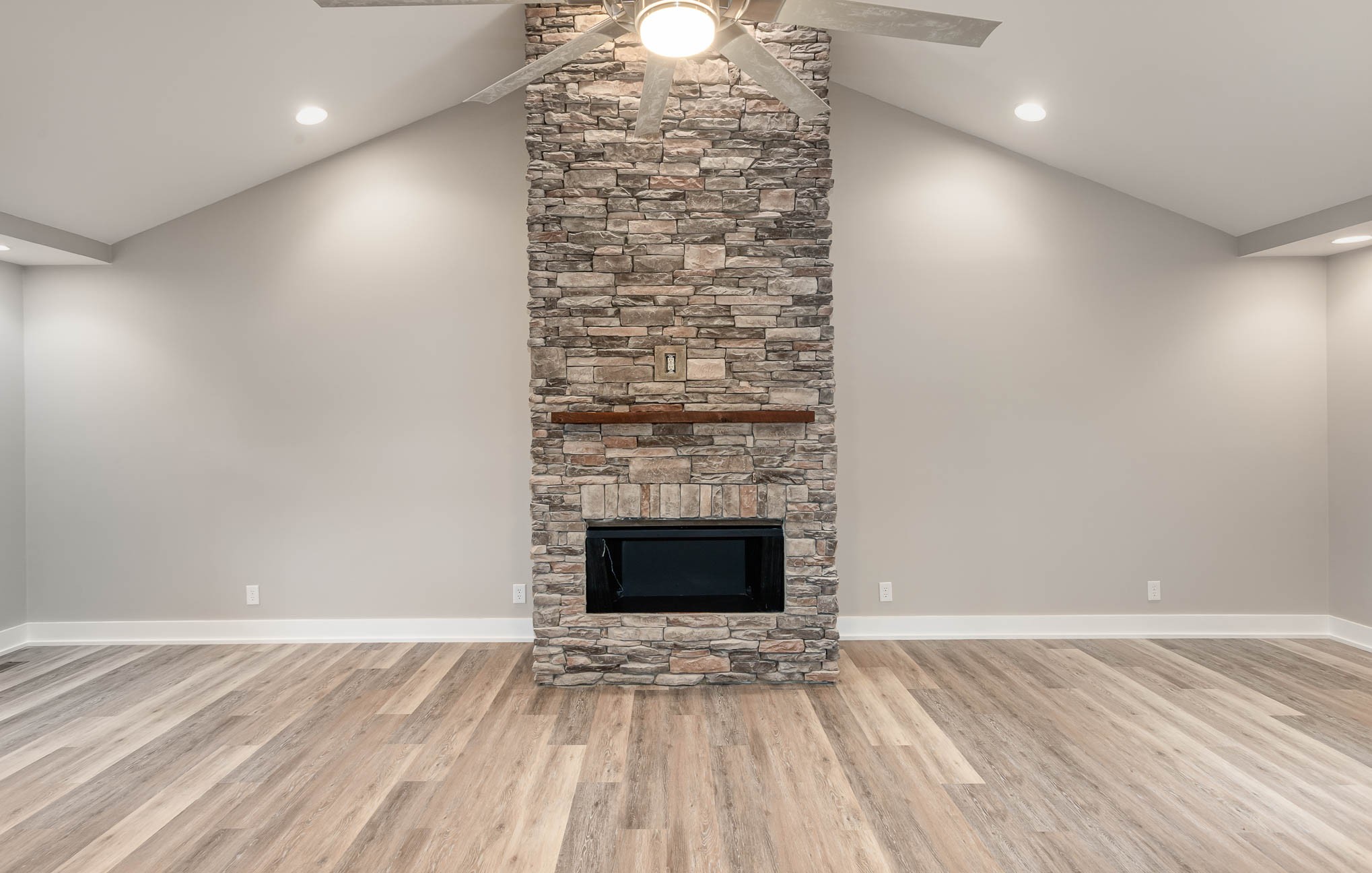 3910 Old Coopertown Road Springfield, TN 37172 - Photo 4 of 30 a view of empty room with wooden floor and fireplace