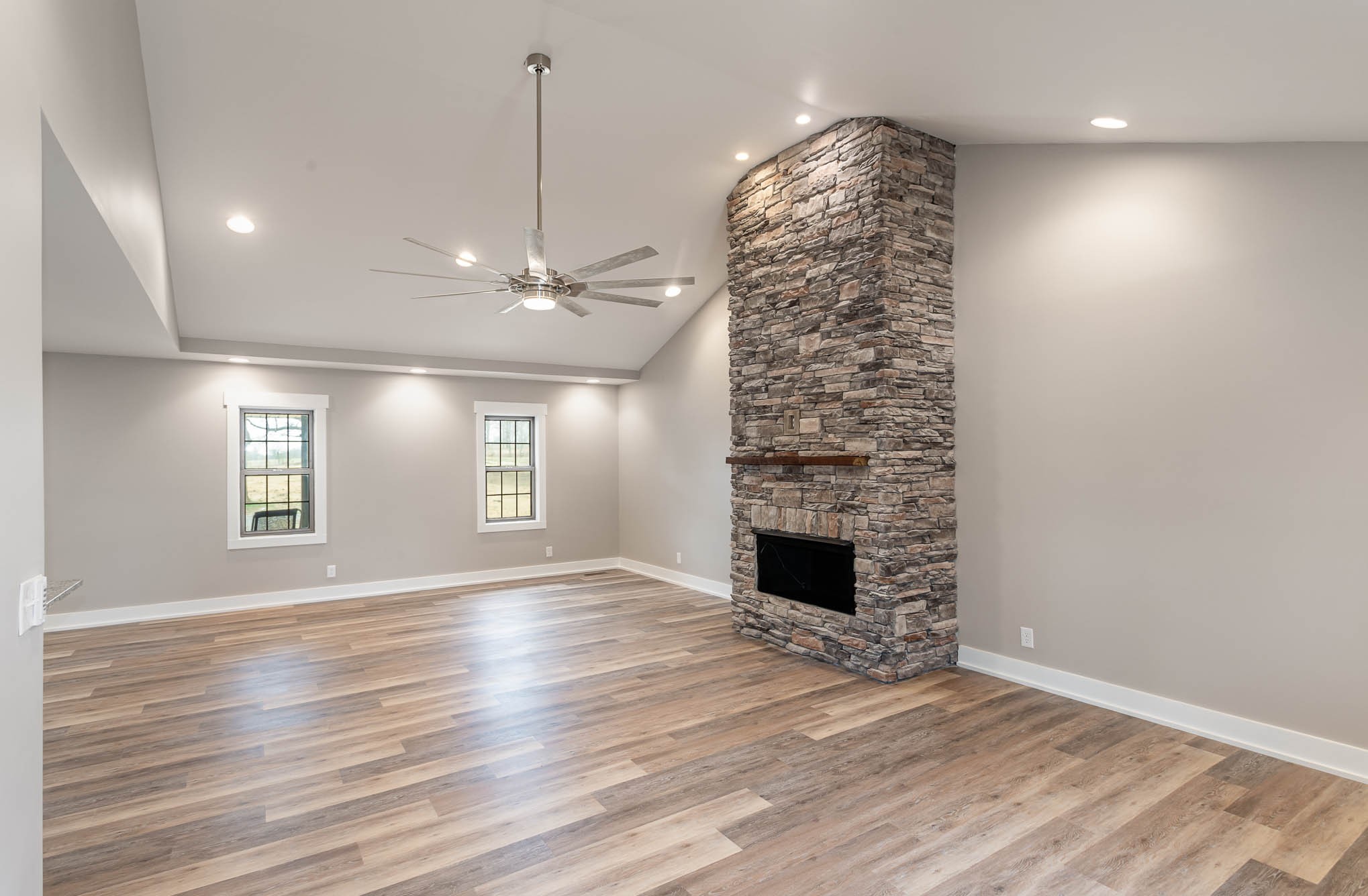 3910 Old Coopertown Road Springfield, TN 37172 - Photo 5 of 30 an empty room with windows and fireplace