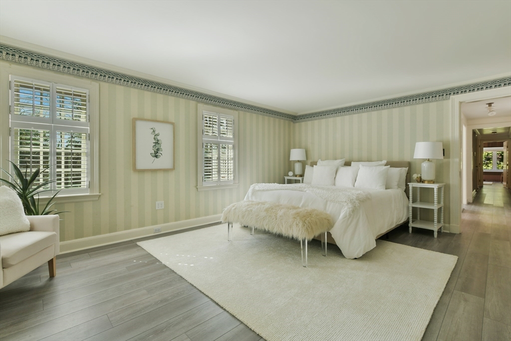 17 Laurel Road Brookline, MA 02467 - Photo 17 of 29 a bedroom with a bed wooden floor and window