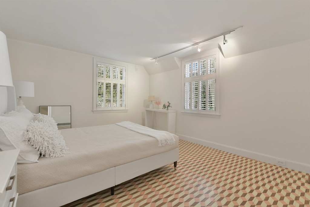 17 Laurel Road Brookline, MA 02467 - Photo 19 of 29 a bedroom with a bed and a window