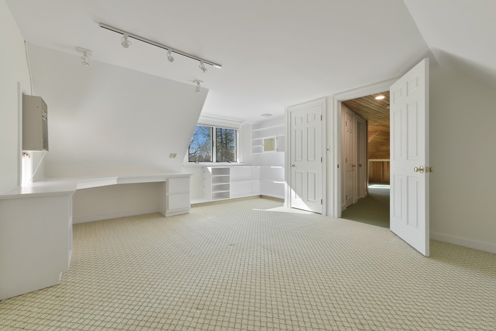 17 Laurel Road Brookline, MA 02467 - Photo 22 of 29 a view of a big room with closet and windows