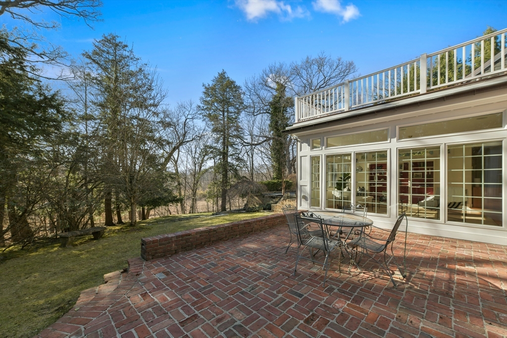 17 Laurel Road Brookline, MA 02467 - Photo 25 of 29 a front view of a house with a yard