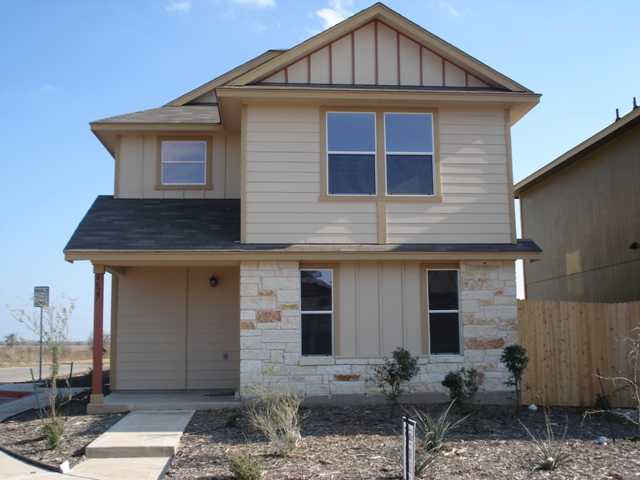 4627 Best Way, Unit 106 Austin, TX 78725 - Photo 1 of 1 a front view of a house with garden