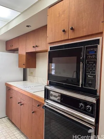 a kitchen with appliances and cabinets