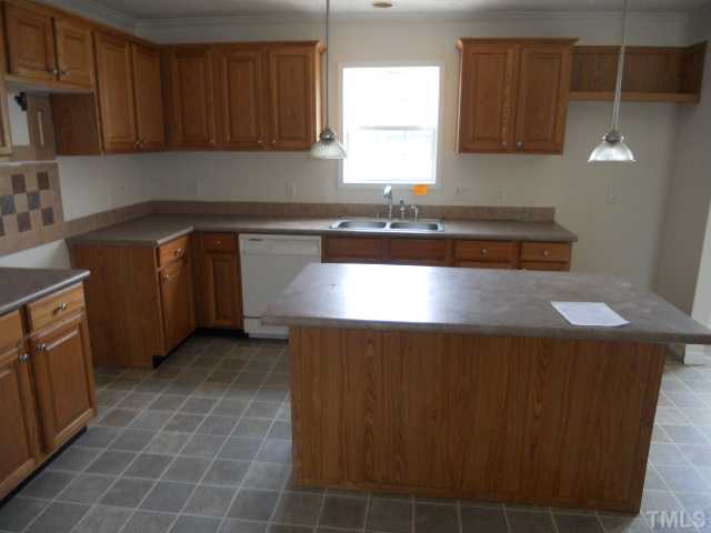 13061 Edwards Road Spring Hope, NC 27882 - Photo 4 of 12 a kitchen with a sink a stove and cabinets