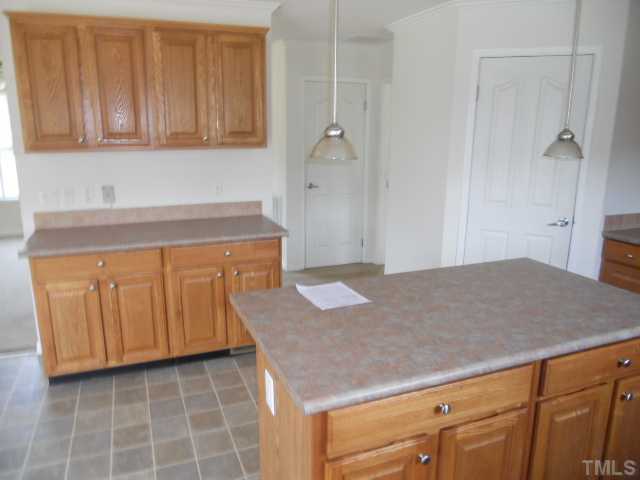 13061 Edwards Road Spring Hope, NC 27882 - Photo 5 of 12 a kitchen with a sink cabinets and wooden floor