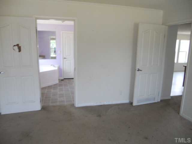 13061 Edwards Road Spring Hope, NC 27882 - Photo 10 of 12 an empty room with windows and a bathroom