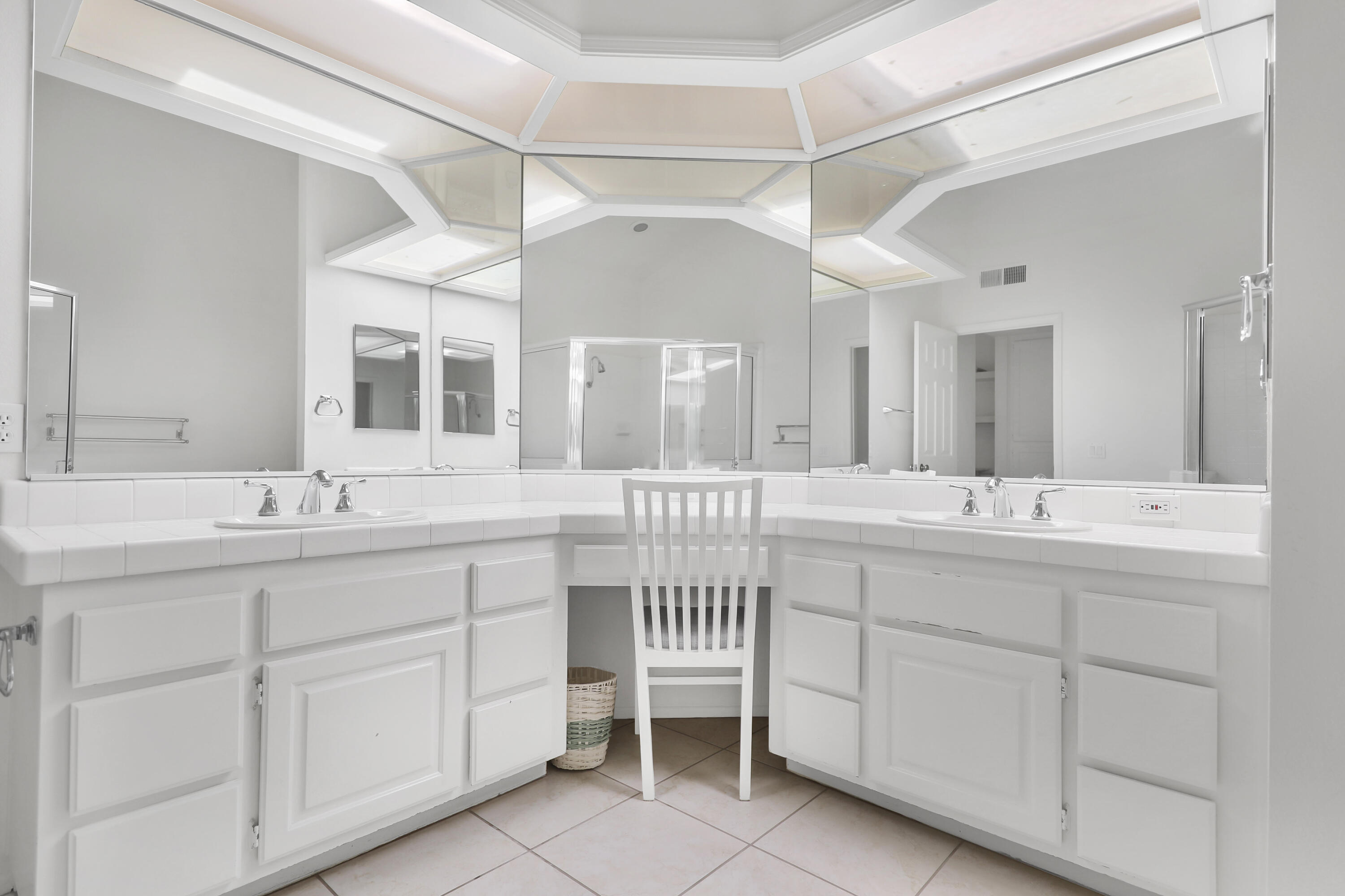 164 Deer Spring Way Palm Desert, CA 92211 - Photo 14 of 30 a spacious bathroom with a double vanity sink and a mirror