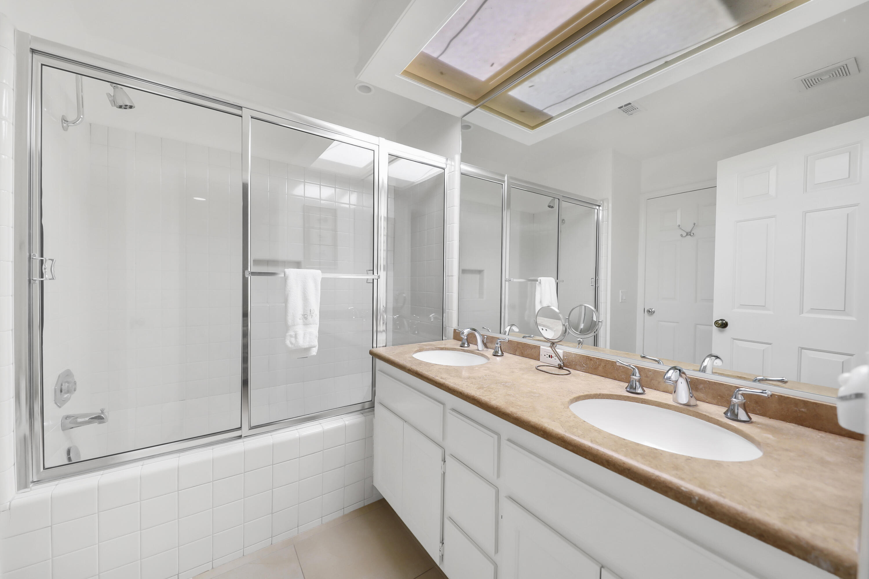 164 Deer Spring Way Palm Desert, CA 92211 - Photo 16 of 30 a bathroom with a double vanity sink mirror and shower