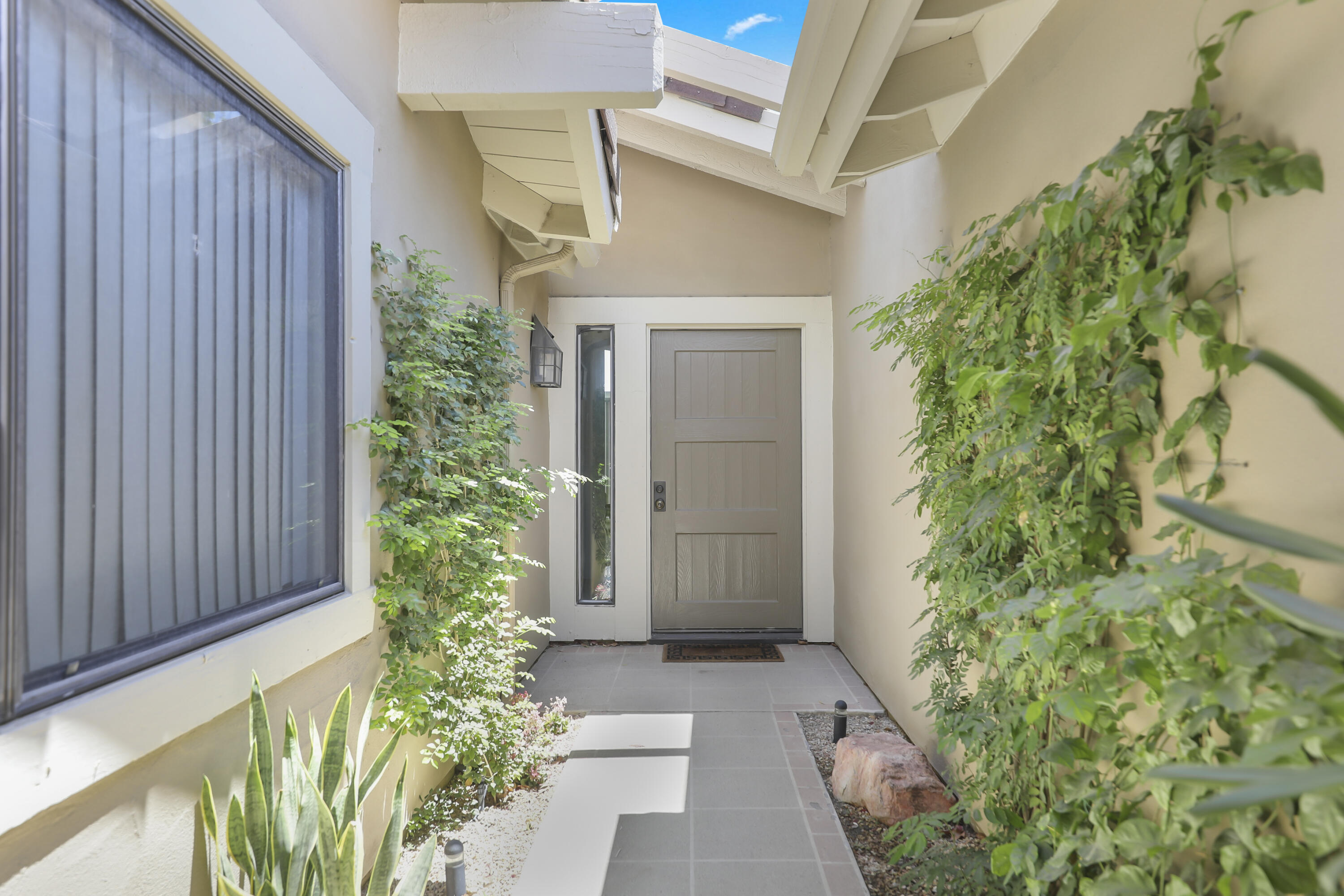 164 Deer Spring Way Palm Desert, CA 92211 - Photo 2 of 30 a front view of a house with a yard