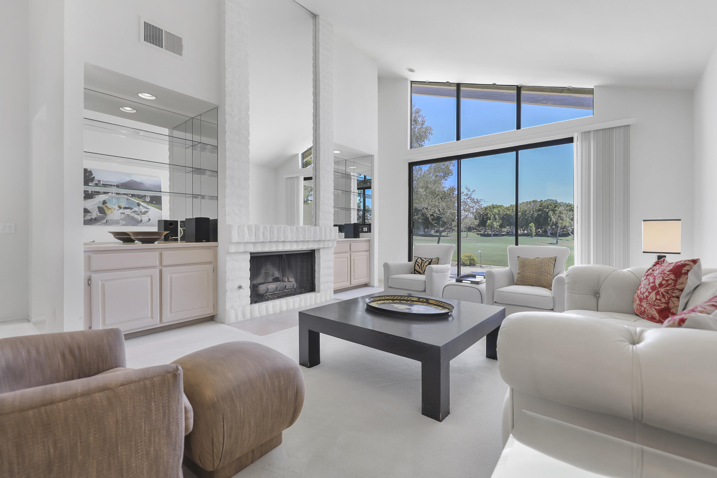 164 Deer Spring Way Palm Desert, CA 92211 - Photo 3 of 30 a living room with furniture and a fireplace