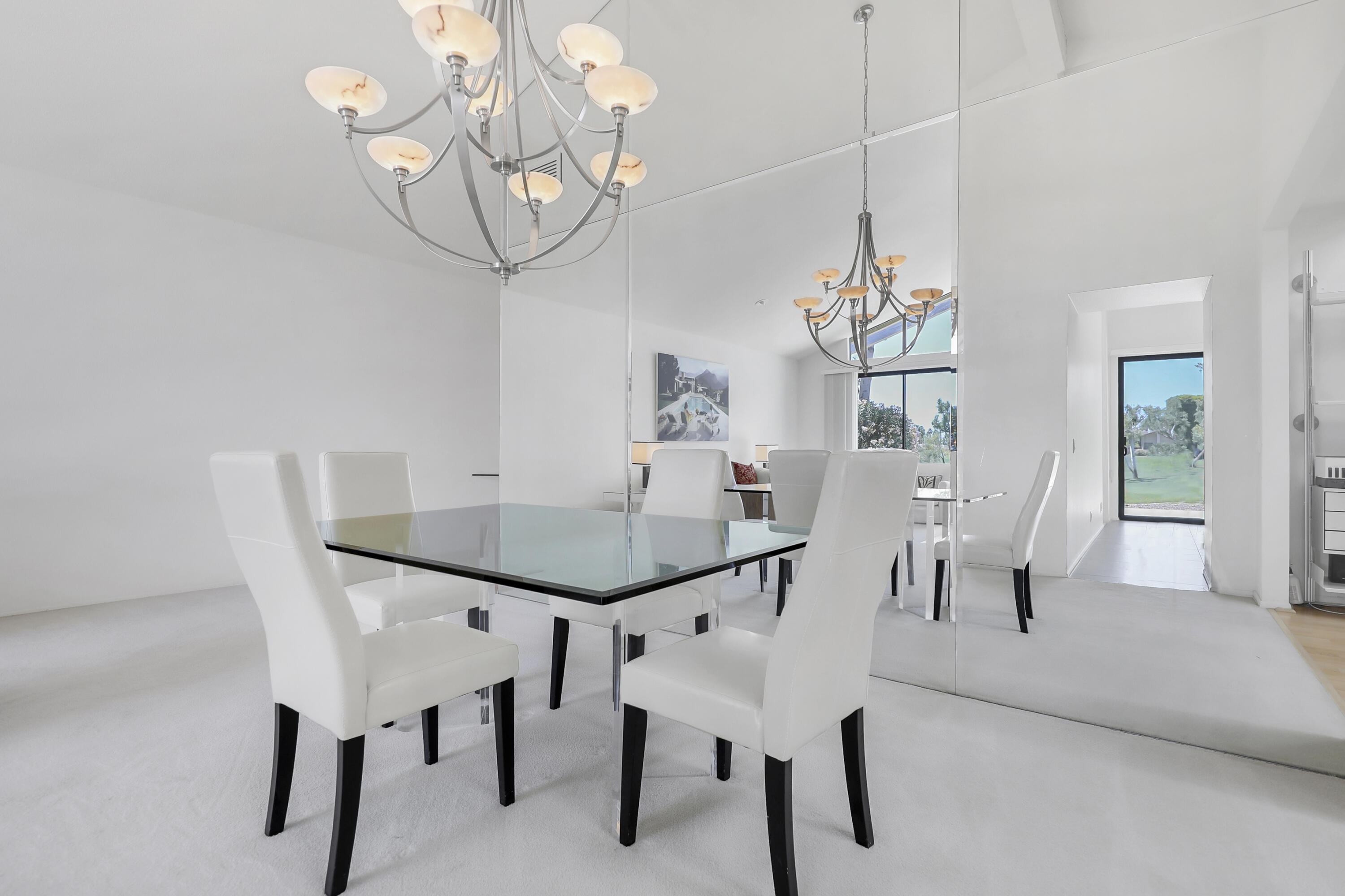164 Deer Spring Way Palm Desert, CA 92211 - Photo 7 of 30 a view of a dining room with furniture and chandelier