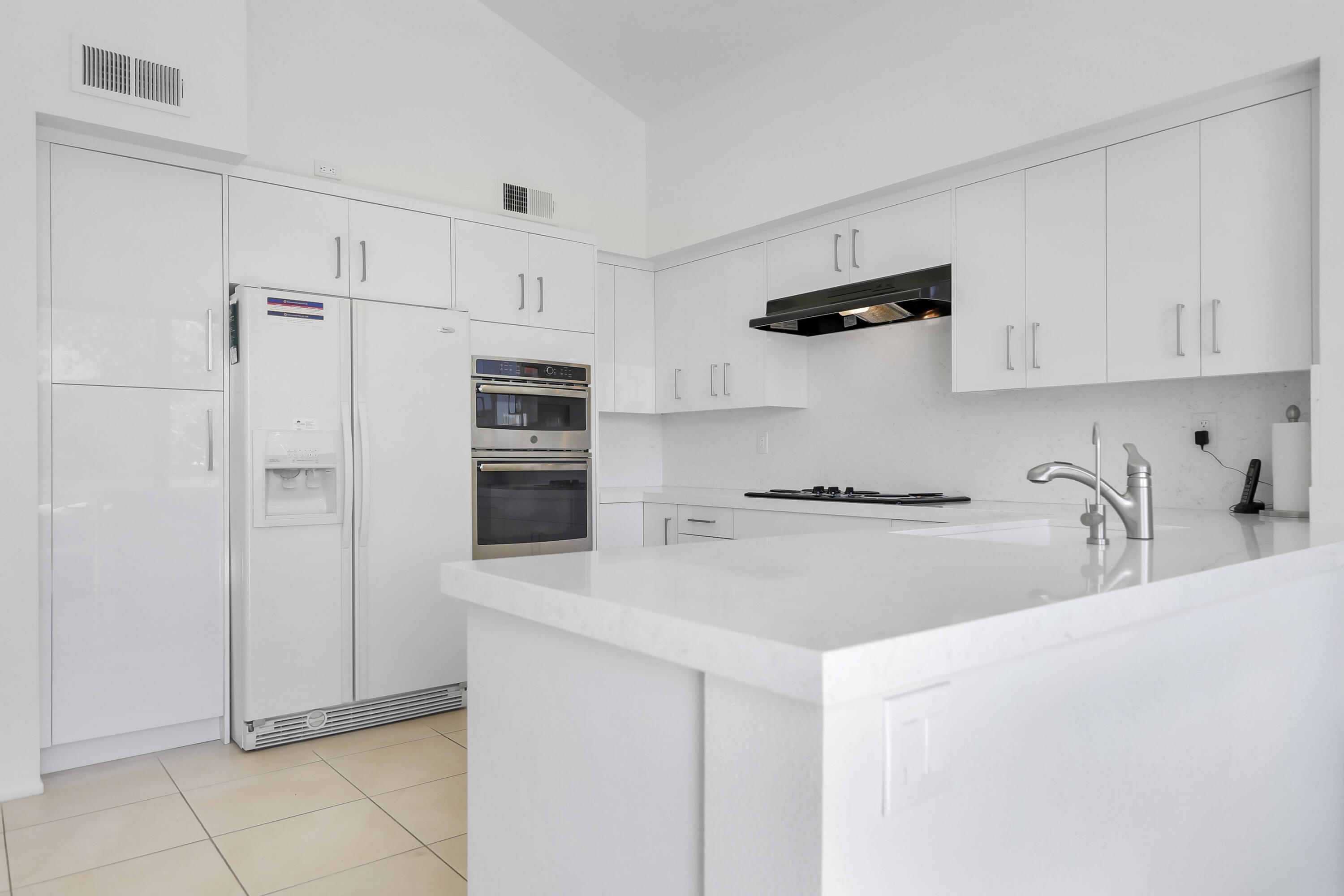 164 Deer Spring Way Palm Desert, CA 92211 - Photo 9 of 30 a kitchen with stainless steel appliances a sink stove and refrigerator