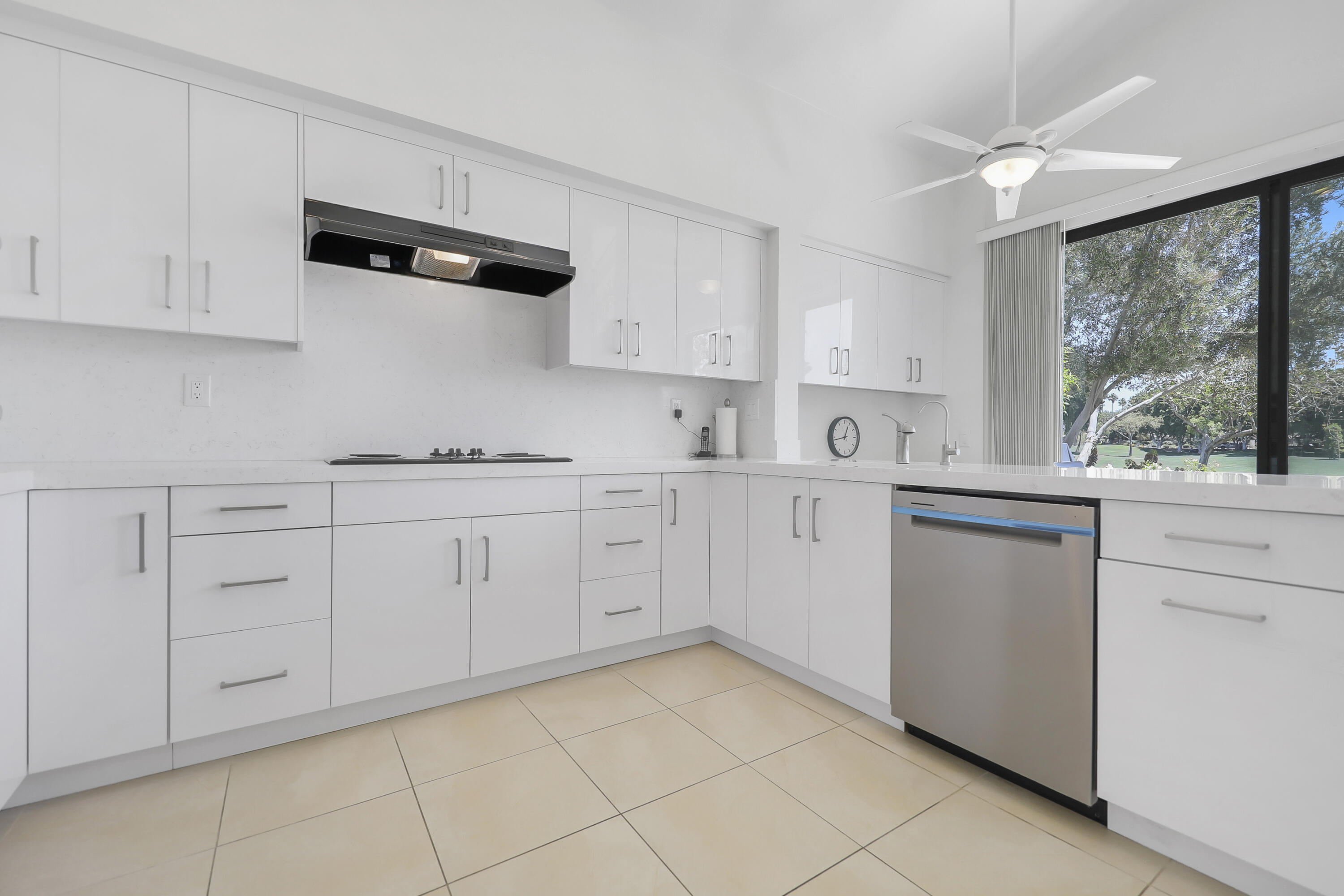164 Deer Spring Way Palm Desert, CA 92211 - Photo 10 of 30 a kitchen with white cabinets white appliances and sink