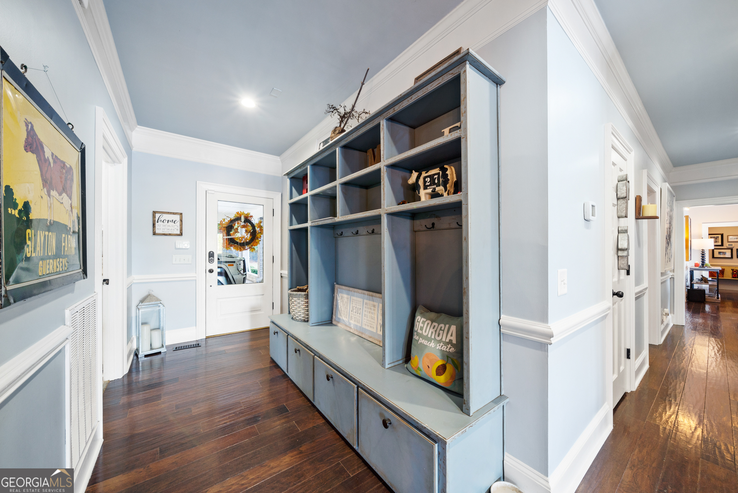 121 Grace Trace Lizella, GA 31052 - Photo 138 of 197 a view of a hallway with wooden floor and furniture