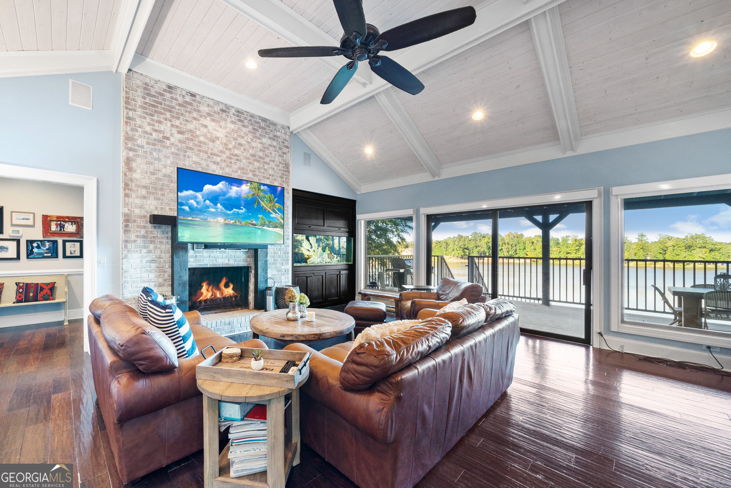 121 Grace Trace Lizella, GA 31052 - Photo 156 of 197 a living room with furniture a fireplace and a flat screen tv