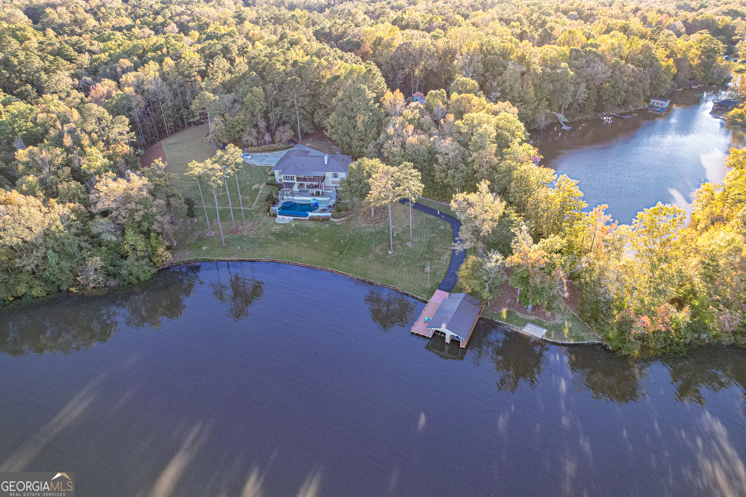 121 Grace Trace Lizella, GA 31052 - Photo 162 of 197 an aerial view of a house with a yard and lake view