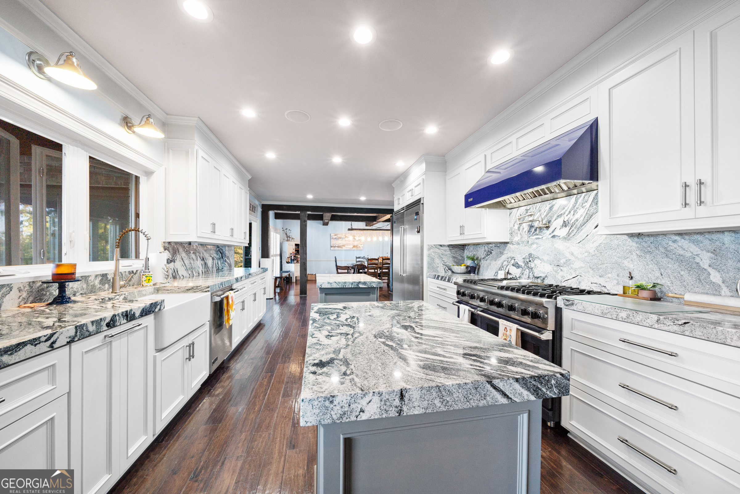 121 Grace Trace Lizella, GA 31052 - Photo 175 of 197 a large kitchen with stainless steel appliances granite countertop a lot of counter space and wooden floors