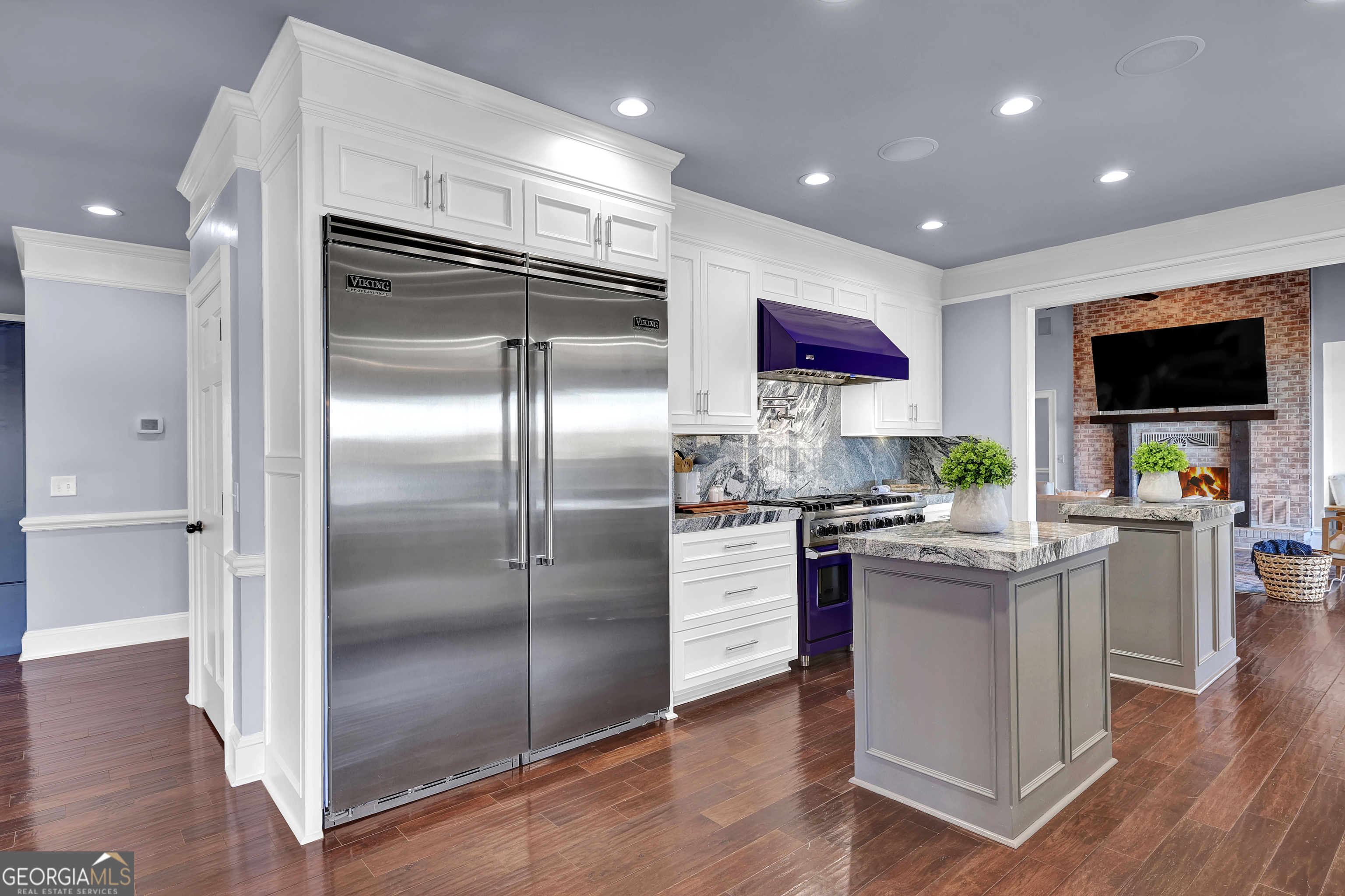 121 Grace Trace Lizella, GA 31052 - Photo 18 of 197 a kitchen with stainless steel appliances granite countertop a refrigerator a stove a sink and a dining table with wooden floor