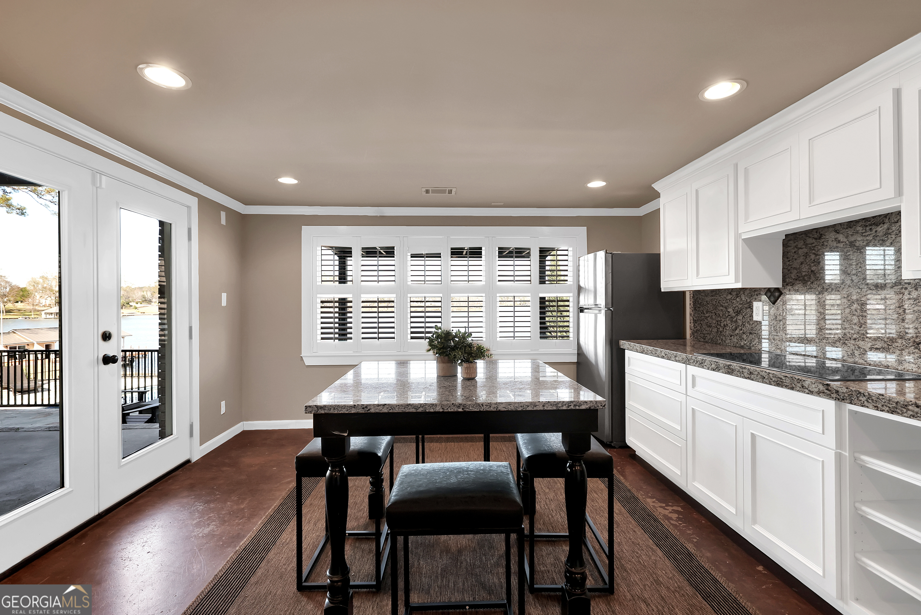 121 Grace Trace Lizella, GA 31052 - Photo 38 of 197 a kitchen with stainless steel appliances kitchen island granite countertop a dining table chairs and view living room