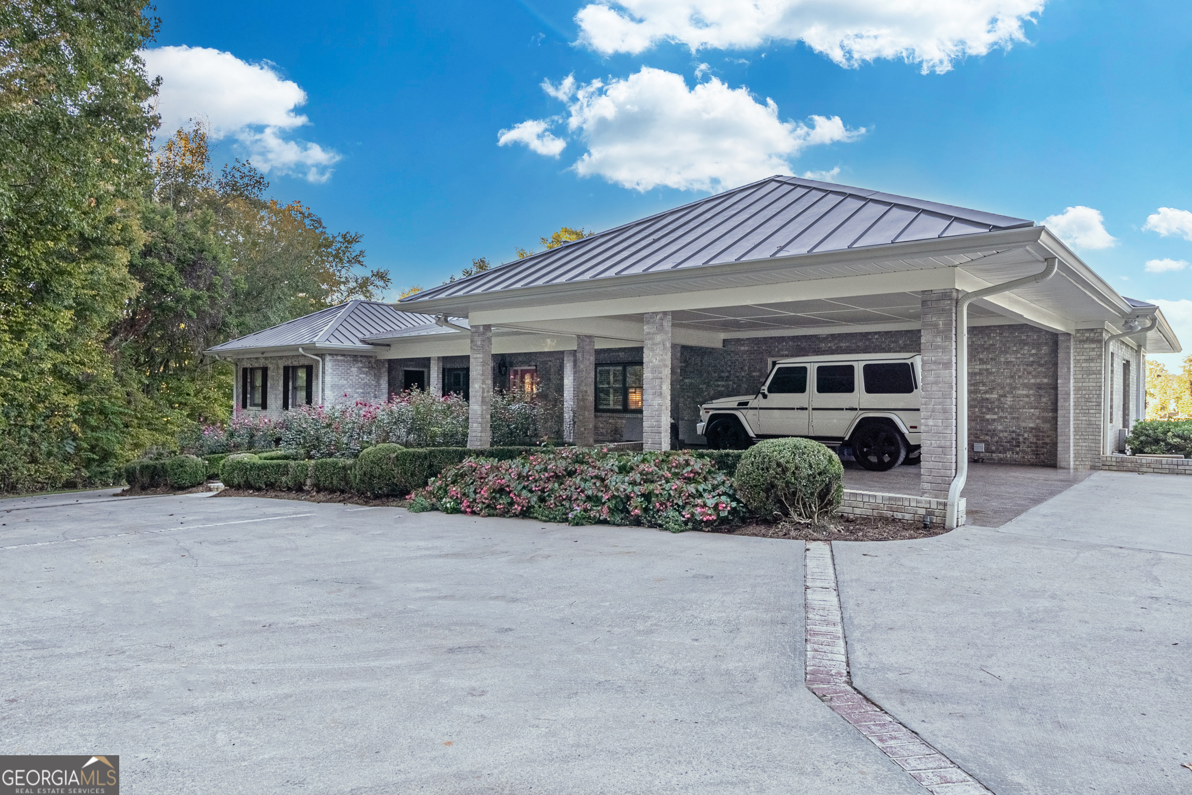 121 Grace Trace Lizella, GA 31052 - Photo 66 of 197 a front view of a house with a yard and potted plants