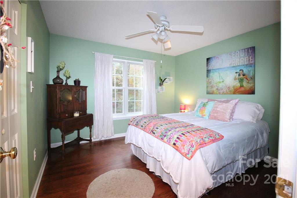 1900 Mt Pleasant Road North Concord, NC 28025 - Photo 15 of 21 a bedroom with a bed and wooden floor