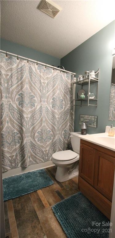 1900 Mt Pleasant Road North Concord, NC 28025 - Photo 16 of 21 a bathroom with a toilet and a shower
