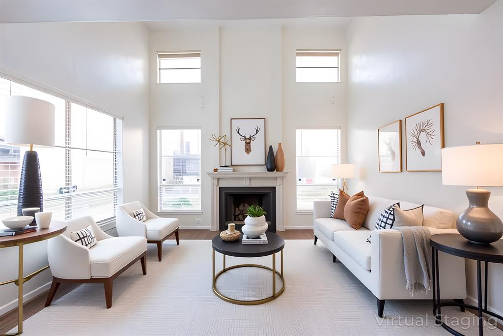 a living room with furniture fireplace and window