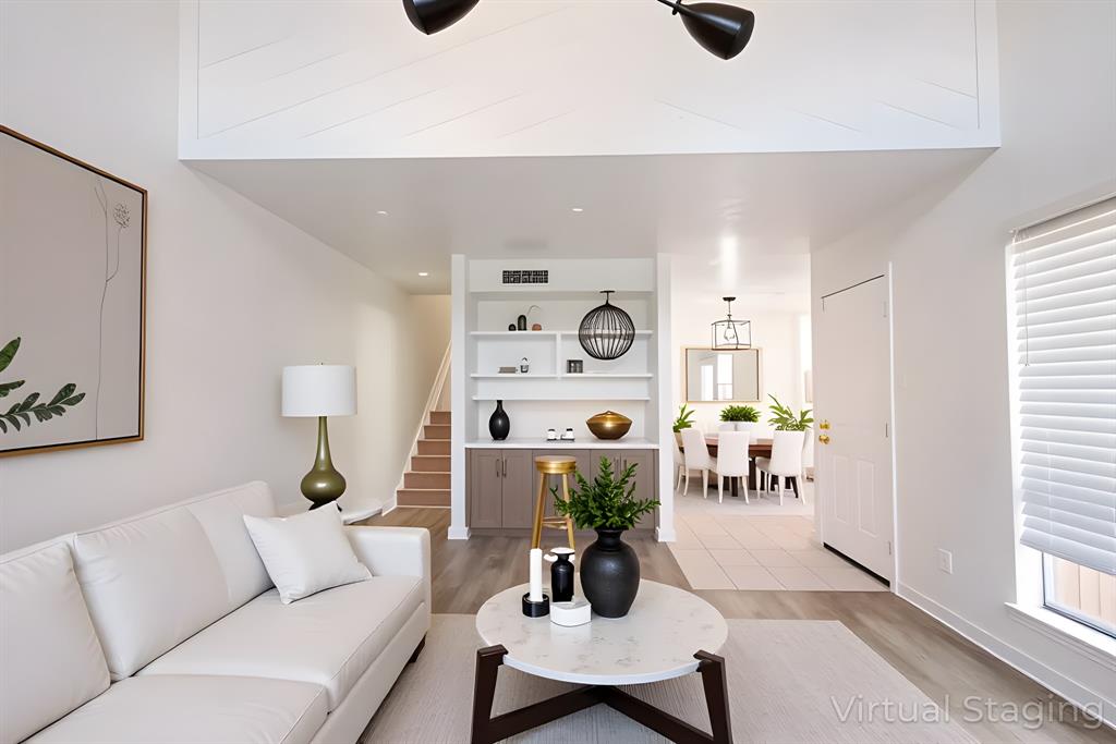 5540 Boca Raton Boulevard, Unit 175 Fort Worth, TX 76112 - Photo 11 of 30 Living room featuring light wood-style floors, stairs, and recessed lighting