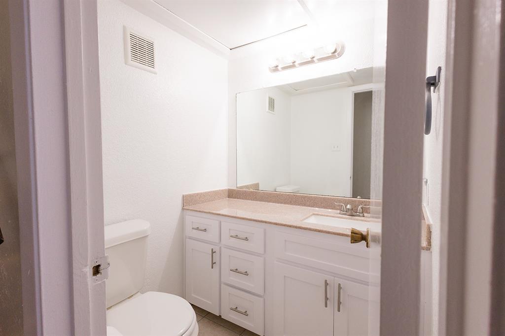 5540 Boca Raton Boulevard, Unit 175 Fort Worth, TX 76112 - Photo 15 of 30 Bathroom with vanity and light tile patterned floors