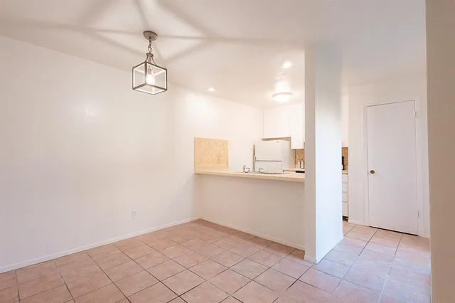 a room view with wooden floor and white doors