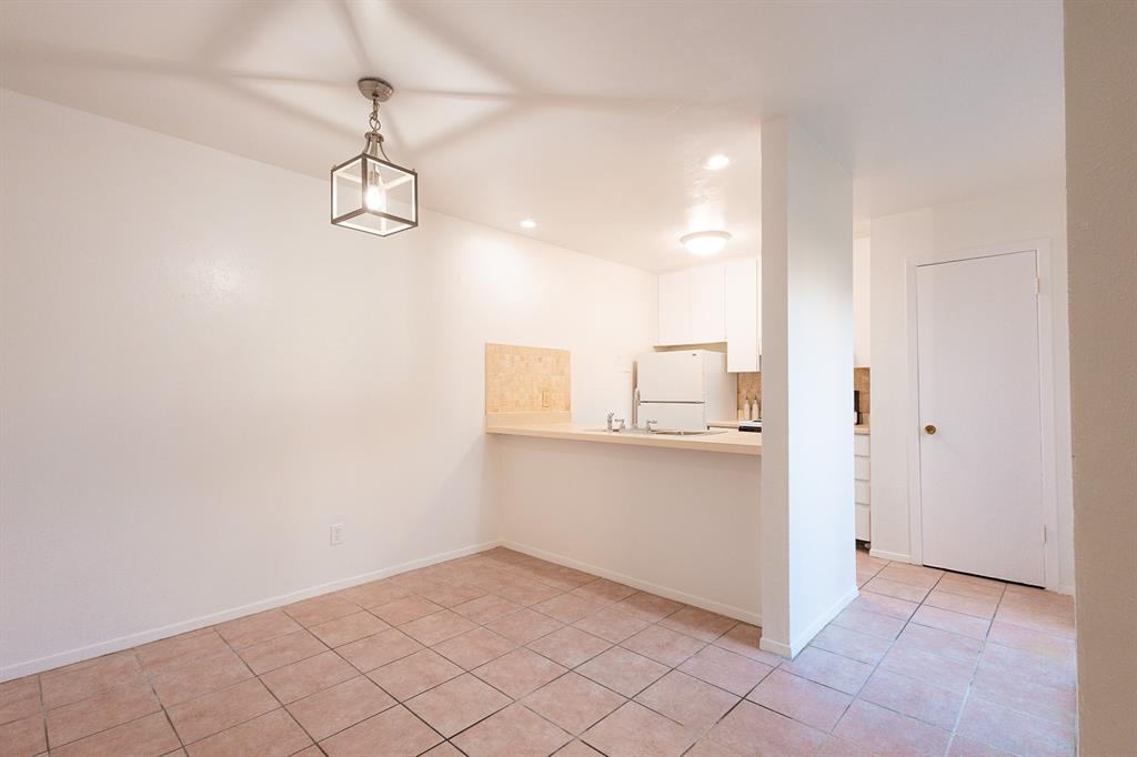 5540 Boca Raton Boulevard, Unit 175 Fort Worth, TX 76112 - Photo 6 of 30 Unfurnished dining area with light tile patterned flooring and recessed lighting