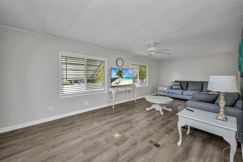 10100 Burnt Store Road, Unit 21 Punta Gorda, FL 33950 - Photo 15 of 61 a living room with furniture and a window