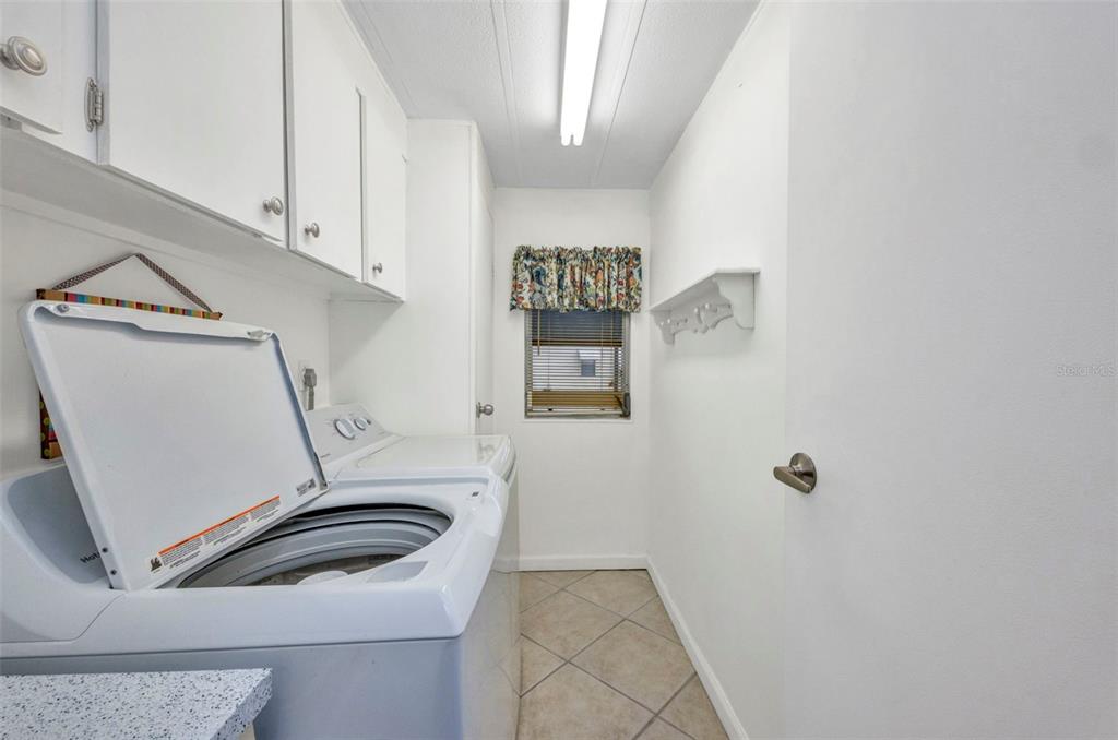10100 Burnt Store Road, Unit 21 Punta Gorda, FL 33950 - Photo 20 of 61 a bathroom with a sink toilet and shower