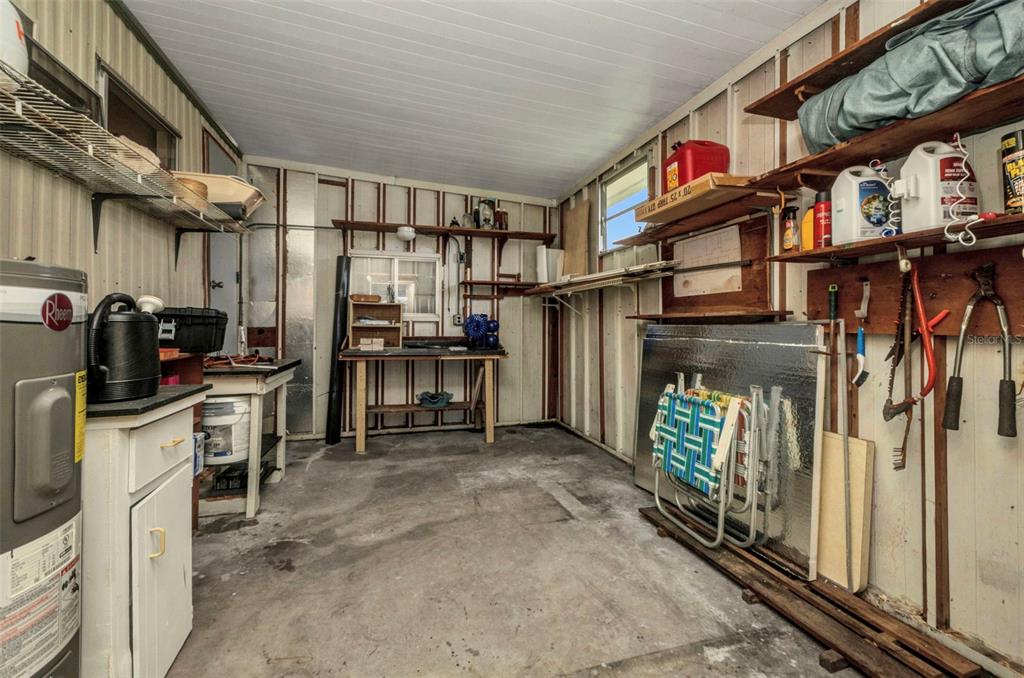 10100 Burnt Store Road, Unit 21 Punta Gorda, FL 33950 - Photo 35 of 61 a kitchen with stainless steel appliances granite countertop a refrigerator and a stove
