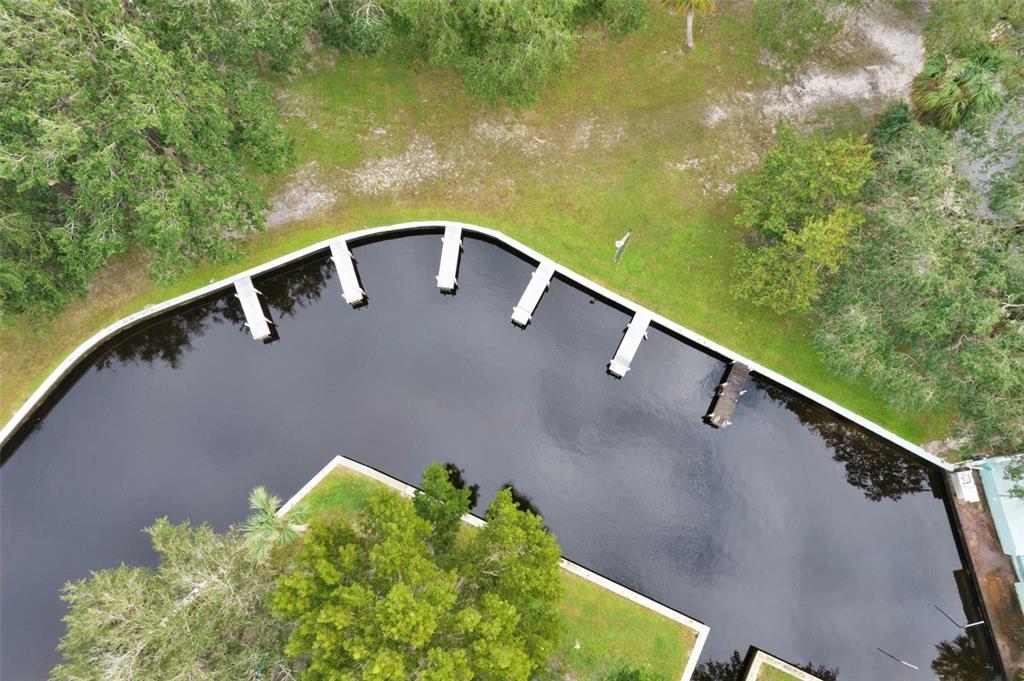 10100 Burnt Store Road, Unit 21 Punta Gorda, FL 33950 - Photo 41 of 61 a view of balcony with a yard and outdoor seating