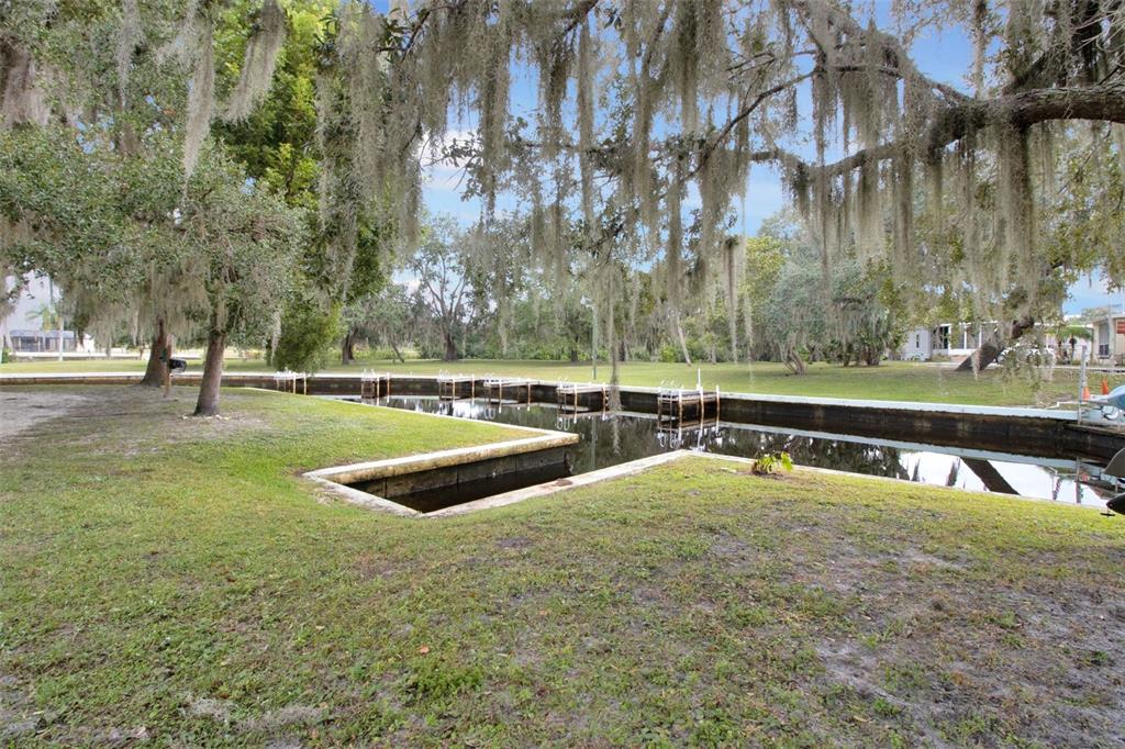 10100 Burnt Store Road, Unit 21 Punta Gorda, FL 33950 - Photo 48 of 61 a view of a swimming pool with a yard