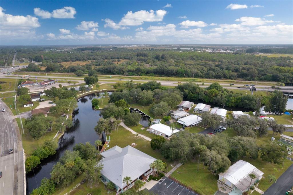 10100 Burnt Store Road, Unit 21 Punta Gorda, FL 33950 - Photo 53 of 61 a view of a lake with a city