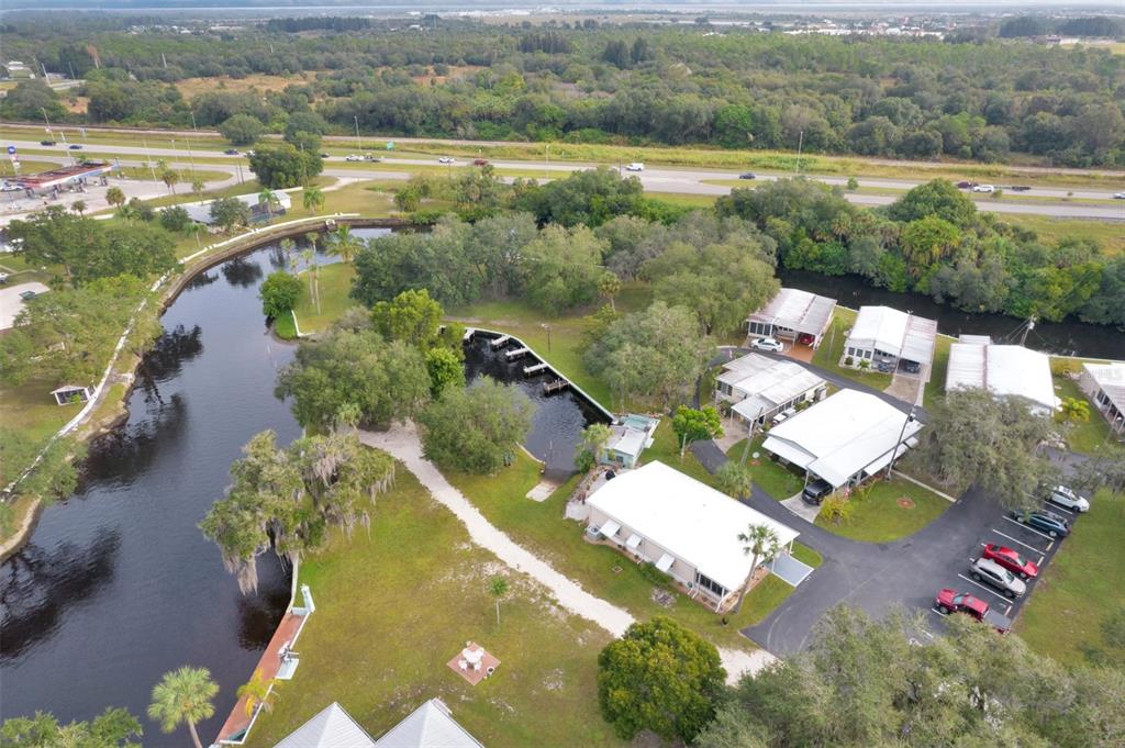 10100 Burnt Store Road, Unit 21 Punta Gorda, FL 33950 - Photo 54 of 61 an aerial view of residential houses with outdoor space and river