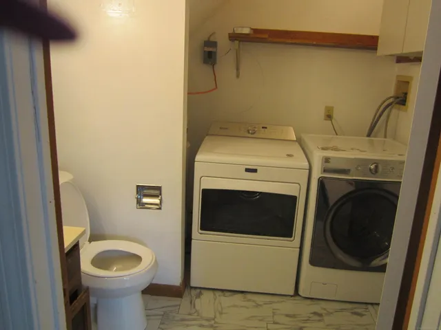 a utility room with dryer and washer