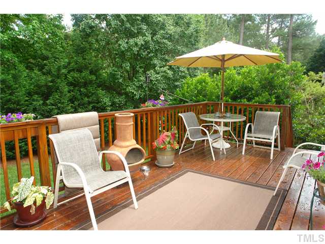 7012 Edgeview Court Raleigh, NC 27613 - Photo 22 of 25 a view of a chairs and table in the patio