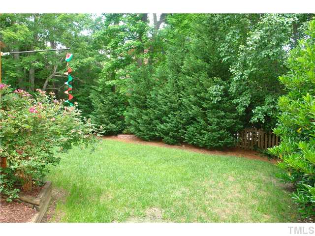 7012 Edgeview Court Raleigh, NC 27613 - Photo 23 of 25 a view of a yard with a tree