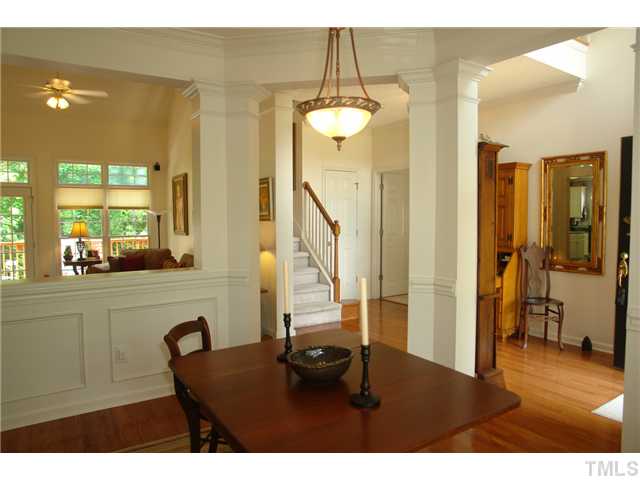 7012 Edgeview Court Raleigh, NC 27613 - Photo 4 of 25 a living room with a table and chairs