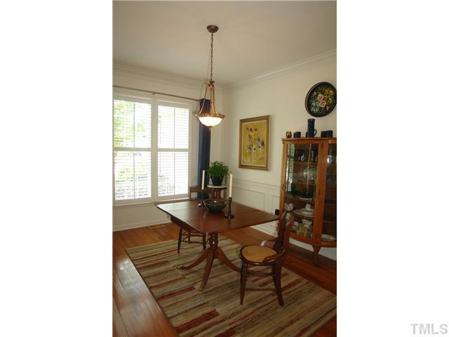 7012 Edgeview Court Raleigh, NC 27613 - Photo 5 of 25 a view of a dining room with a table and chairs