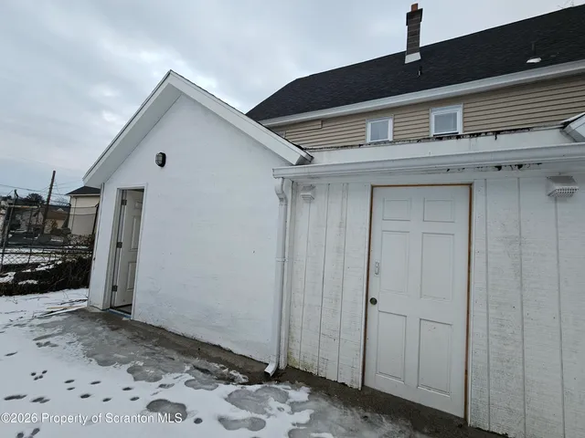 a view of a house with a wooden door
