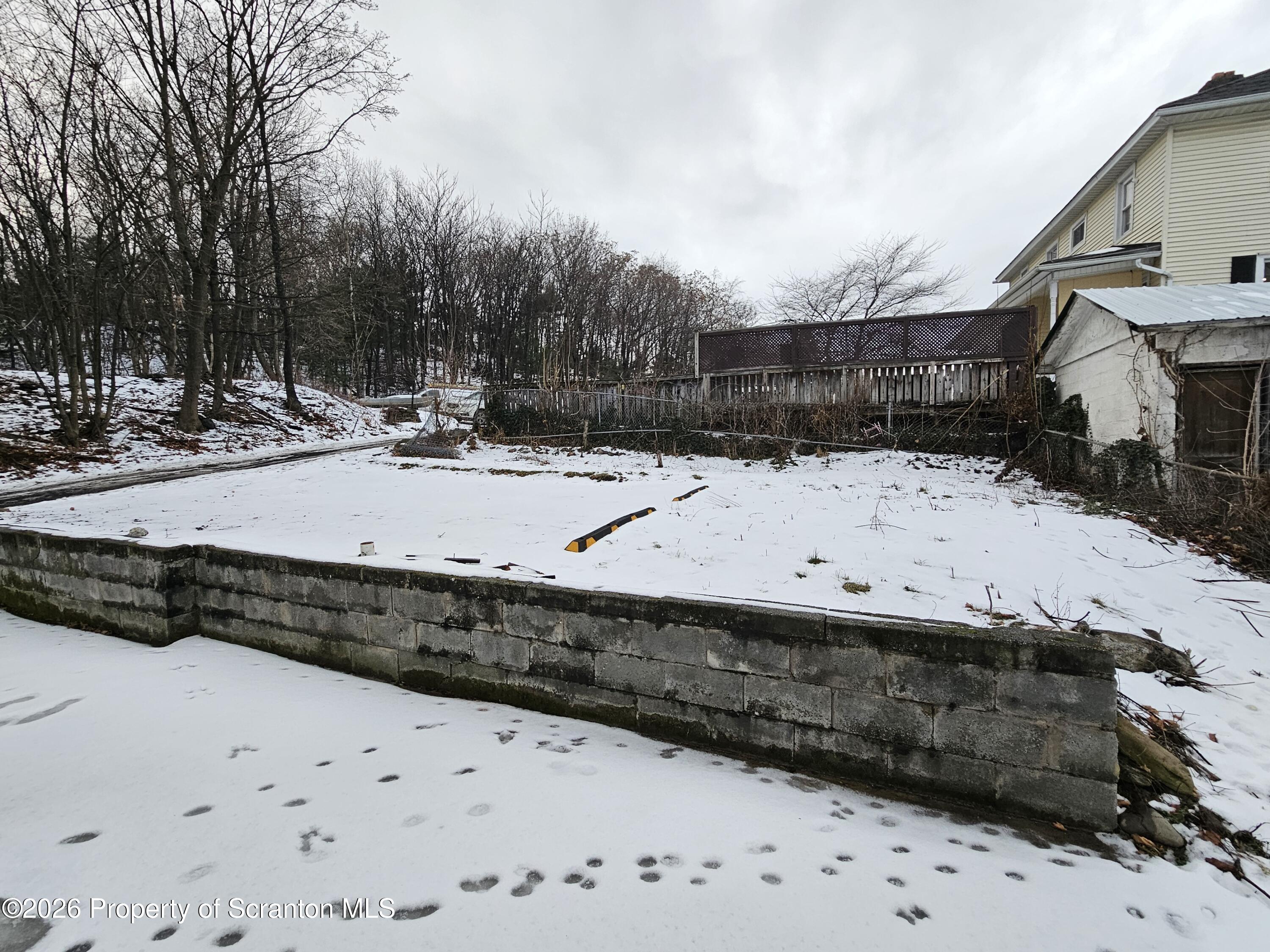 1517 Brick Avenue Scranton, PA 18508 - Photo 12 of 12 a view of a yard covered in snow