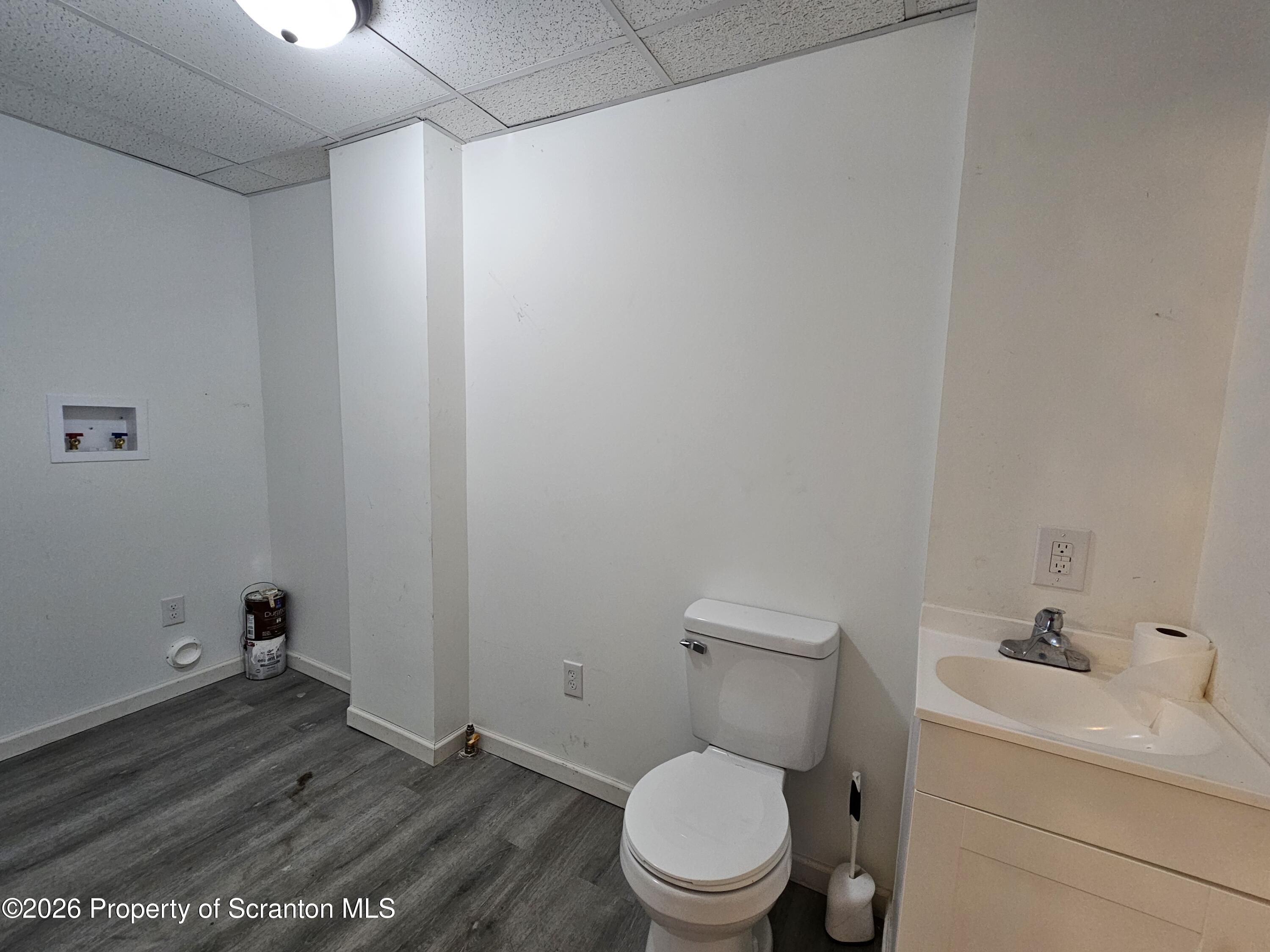 1517 Brick Avenue Scranton, PA 18508 - Photo 5 of 12 a white toilet sitting next to a bathroom sink