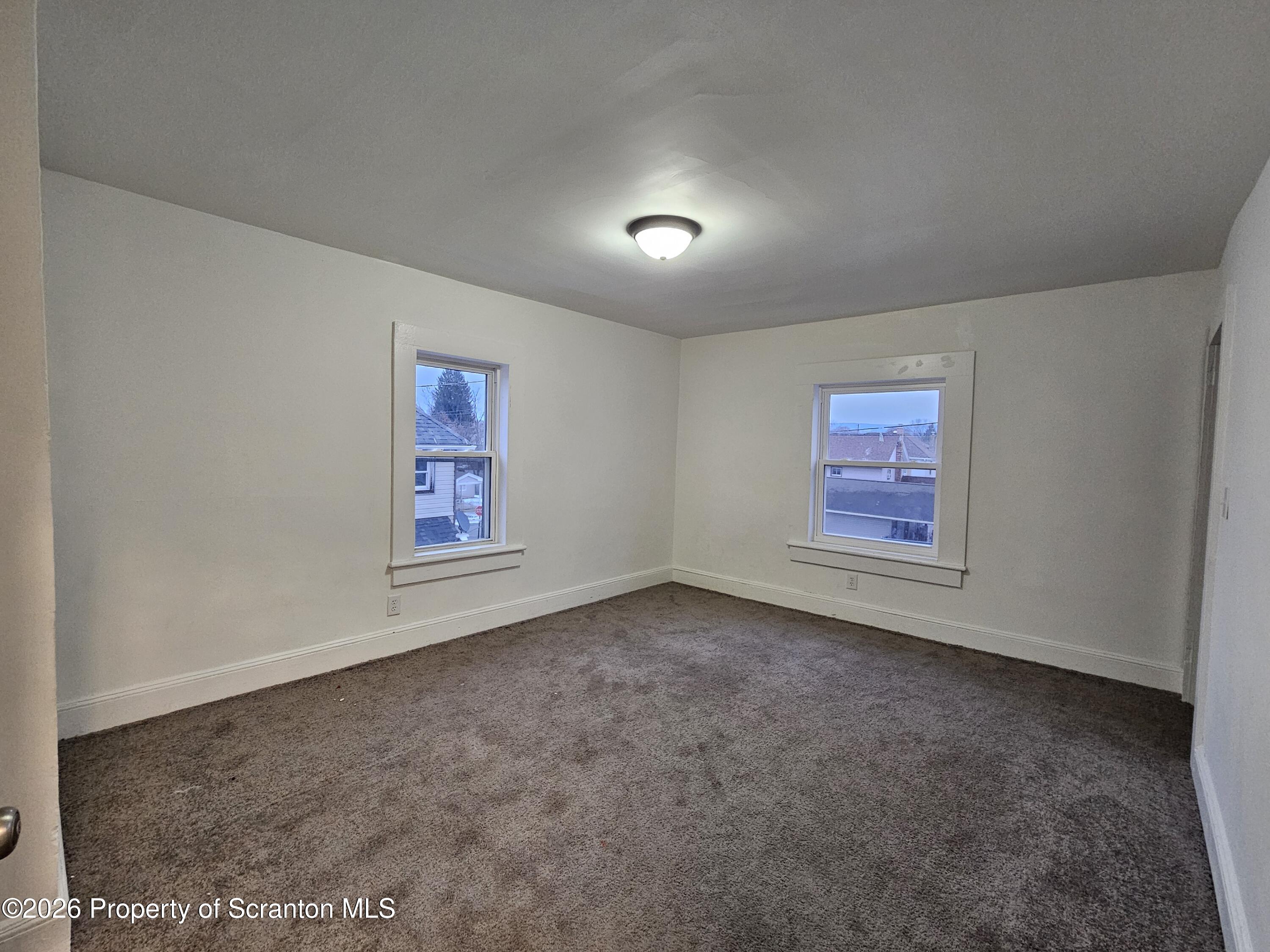 1517 Brick Avenue Scranton, PA 18508 - Photo 8 of 12 an empty room with windows